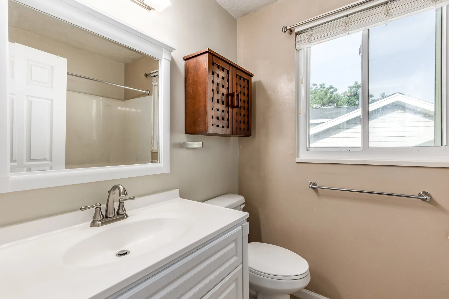Bathroom with white vanity and chrome fixtures