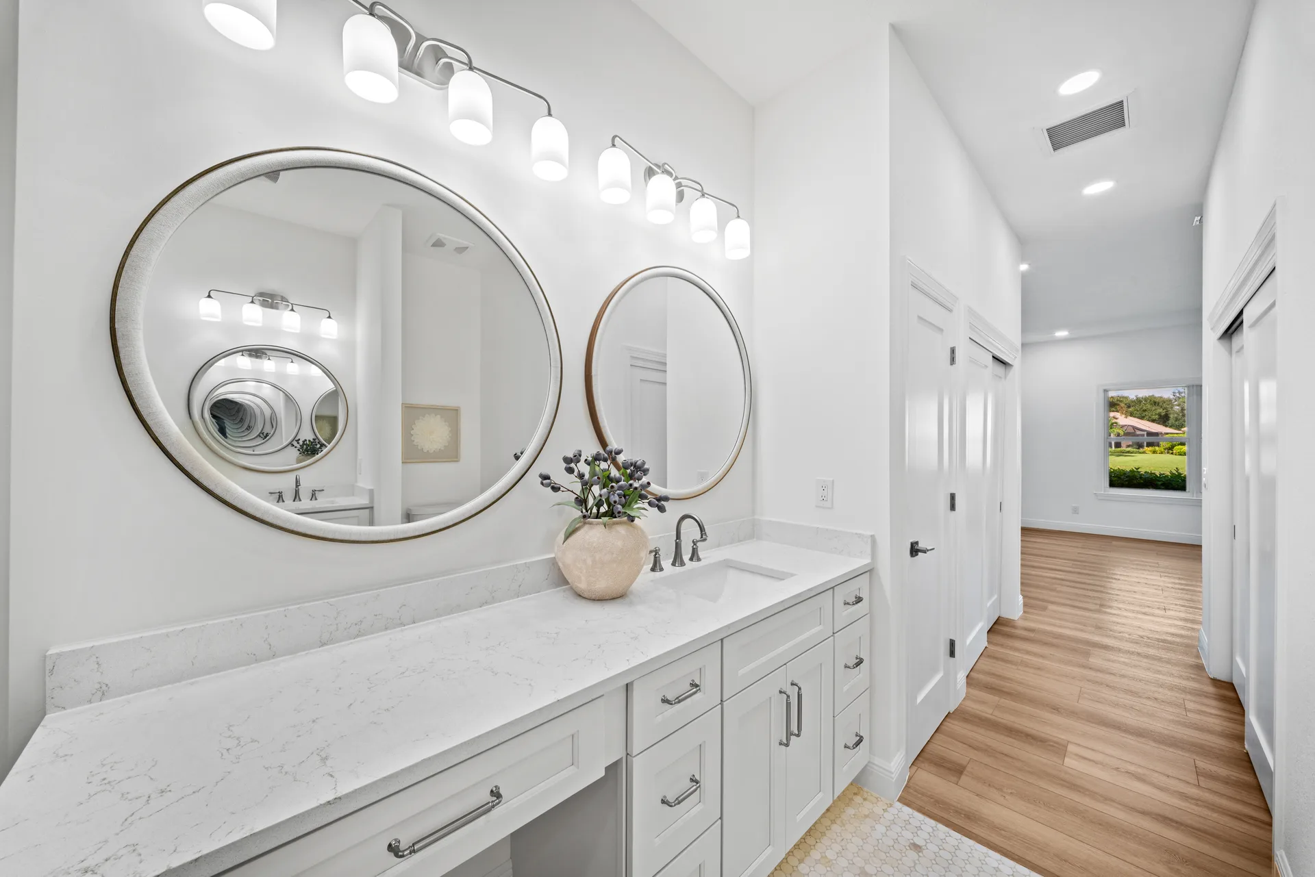 Bathroom vanity with dual circular mirrors