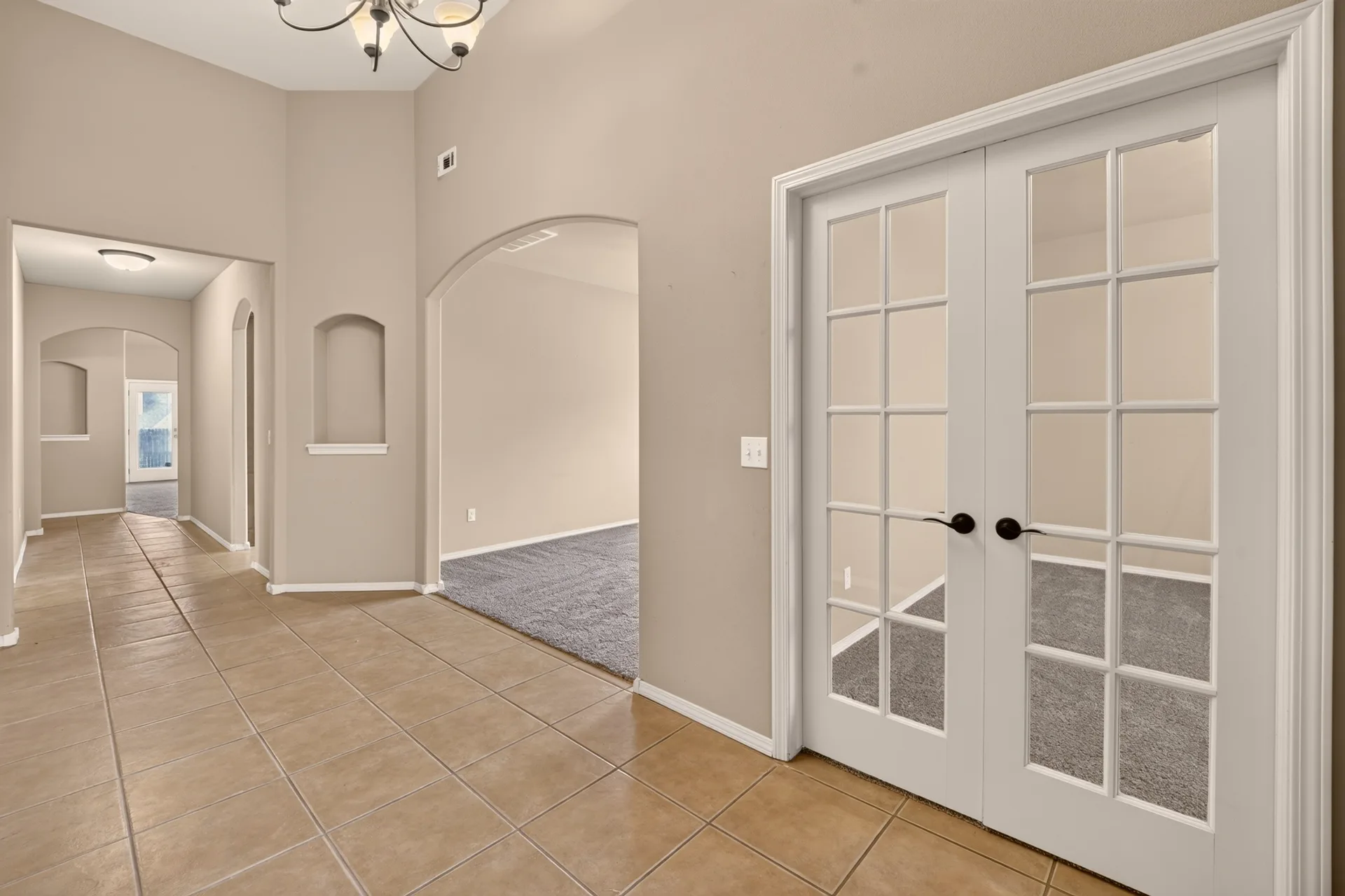 Entryway hall with arched doorways
