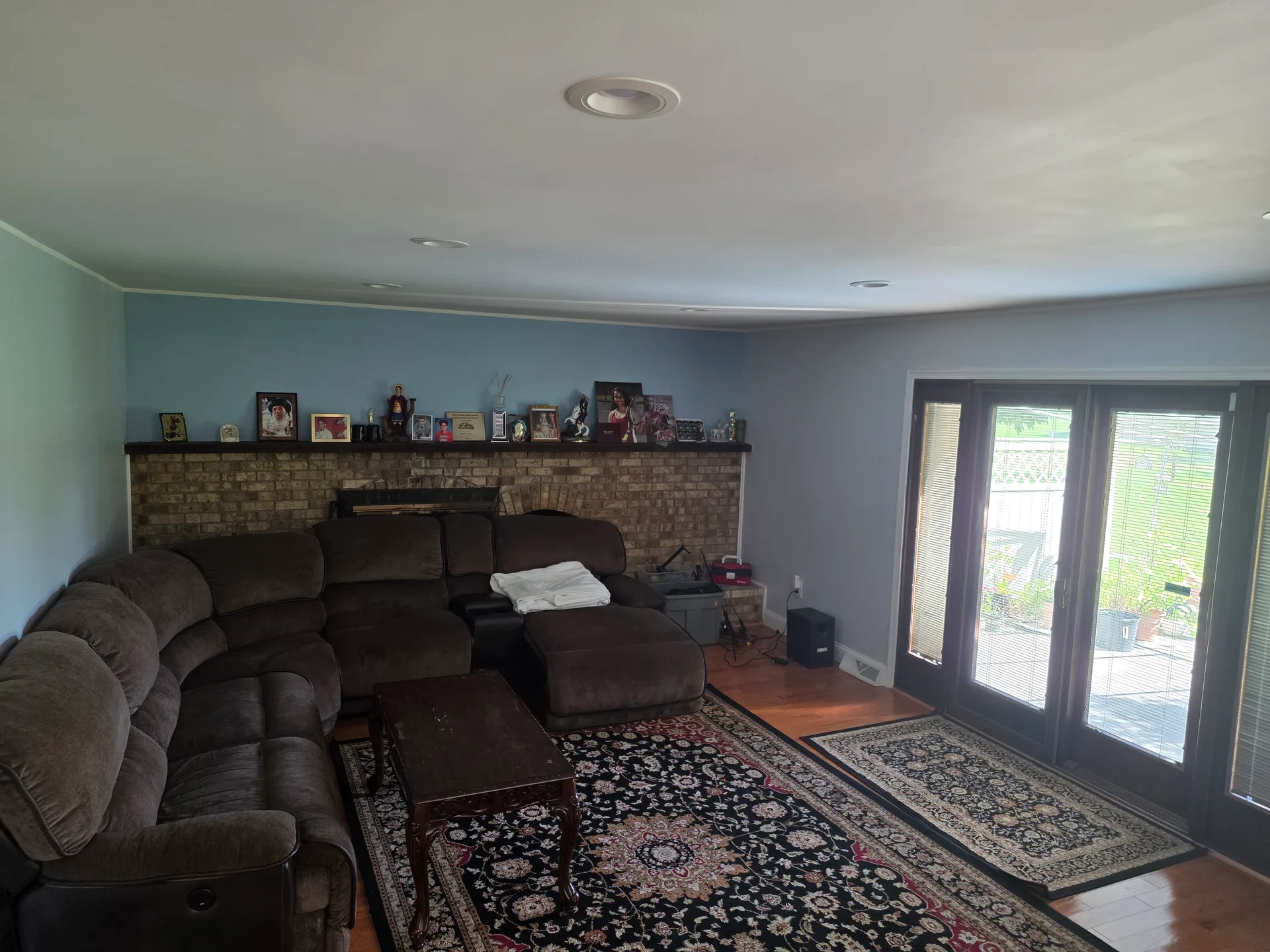 Family room with brick fireplace and patio doors