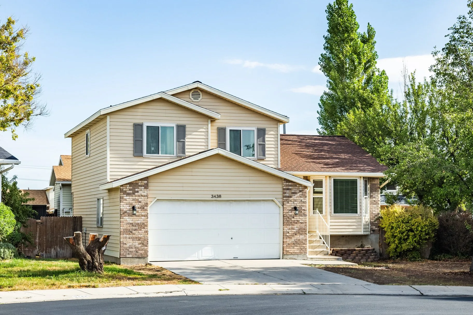 Front exterior of 3438 W Charlesworth Cir, a split-level home in West Jordan, Utah