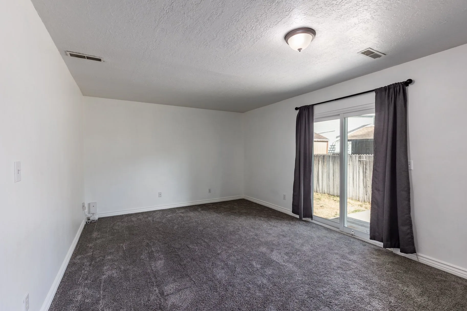 Lower-level living area with sliding glass door