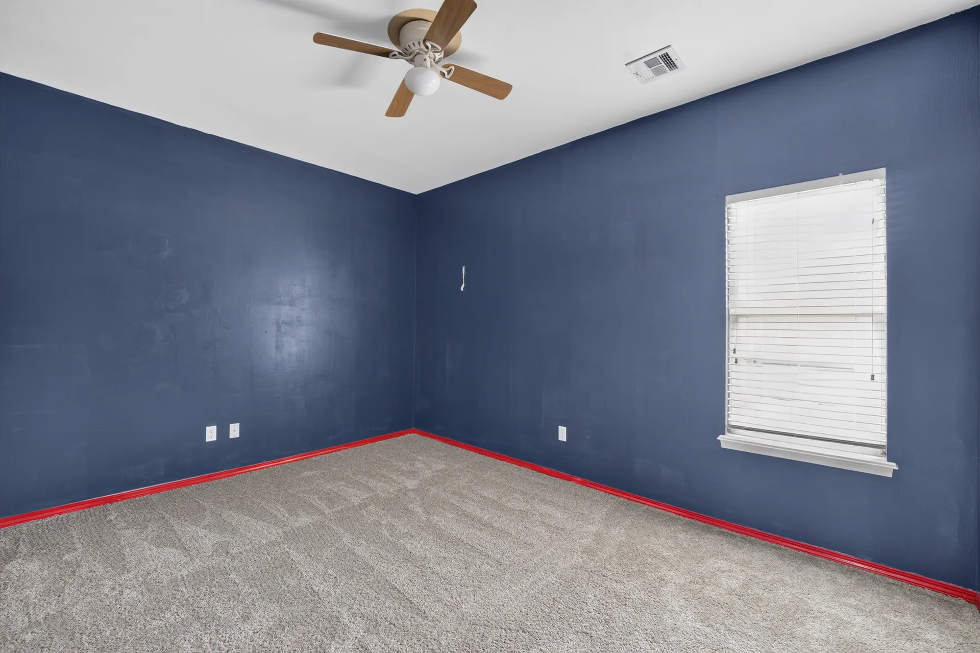 Bedroom with bold blue walls