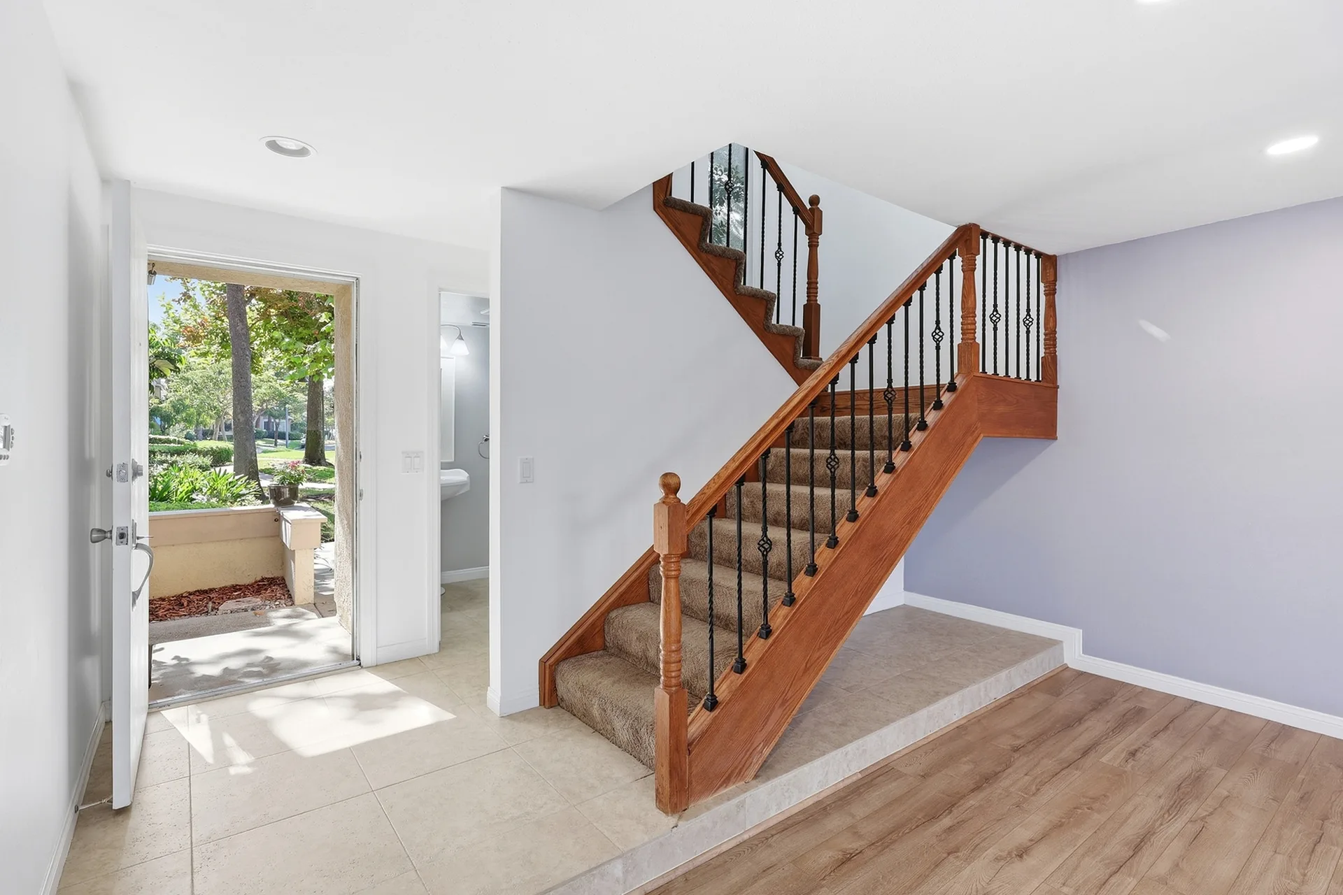 Entry hall at 8 Silverwood looking toward the front door with natural daylight streaming in