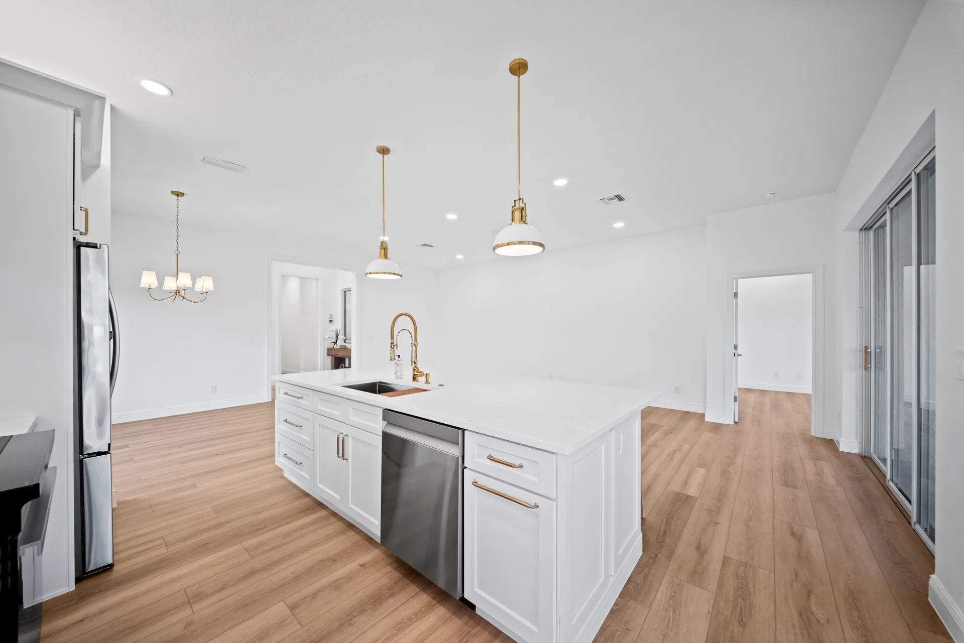White shaker cabinetry and quartz countertops at 878 Vistana Circle Naples FL