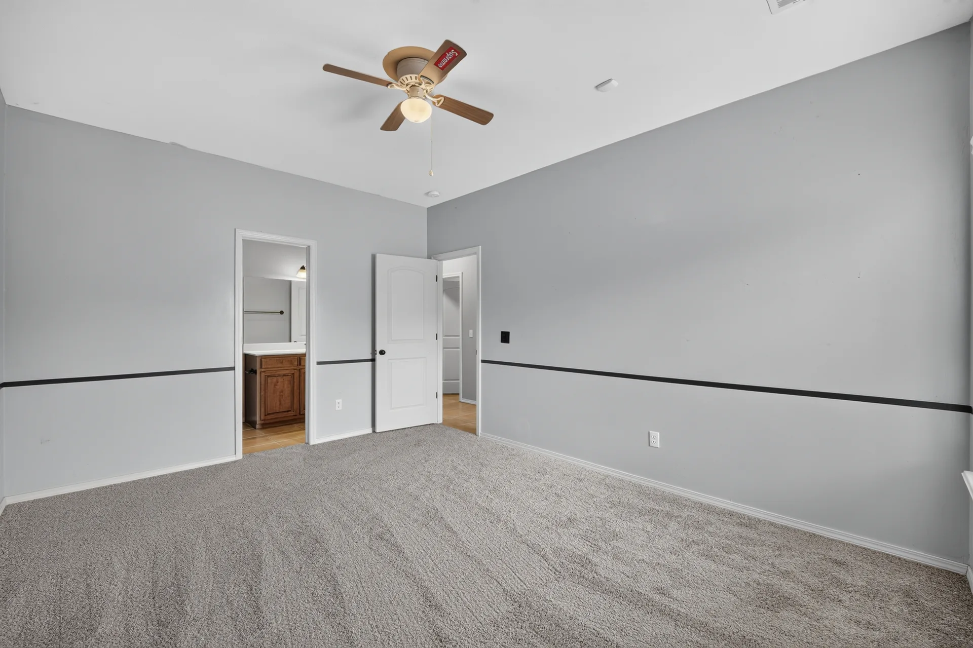 Primary bedroom with chair rail accent