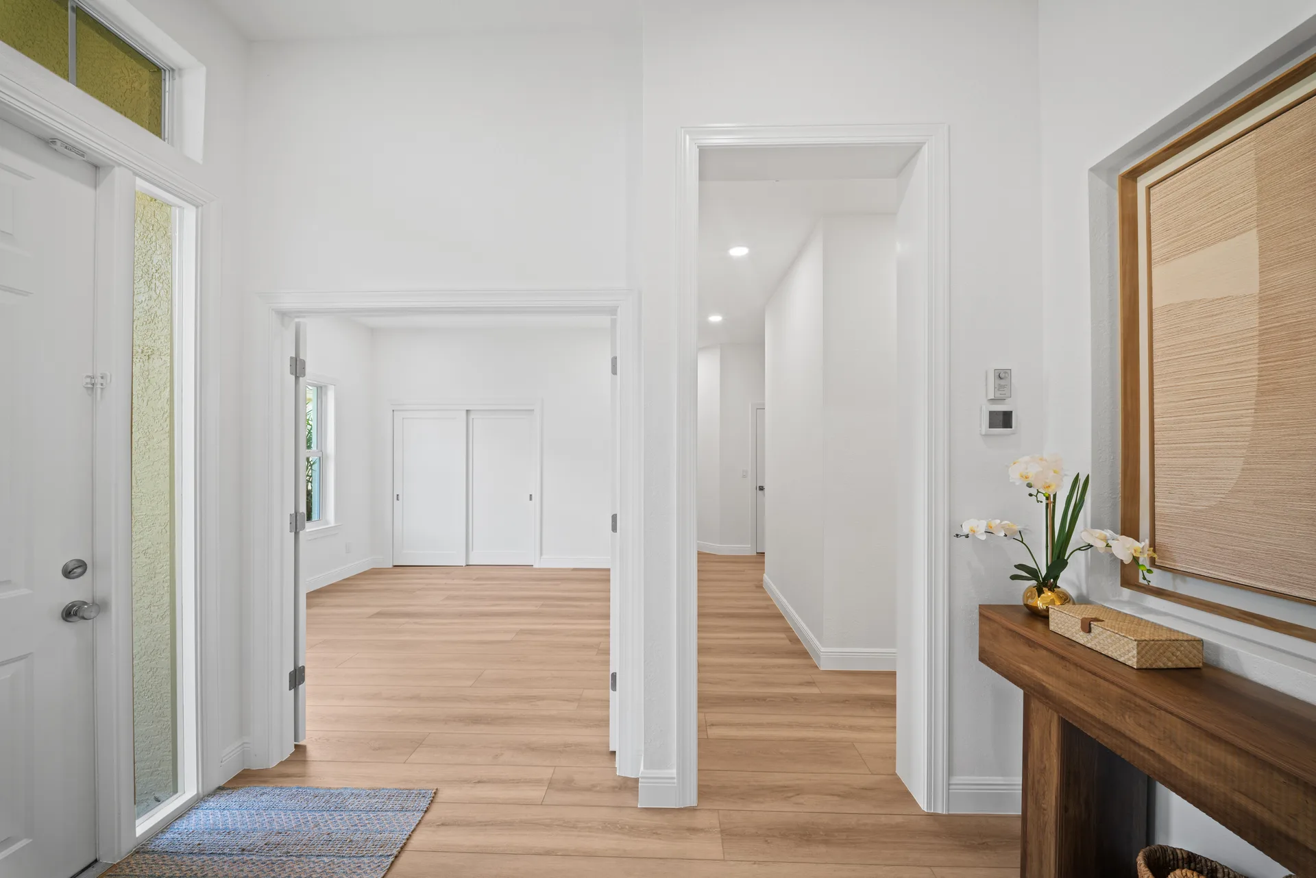 Entryway with light wood plank floors