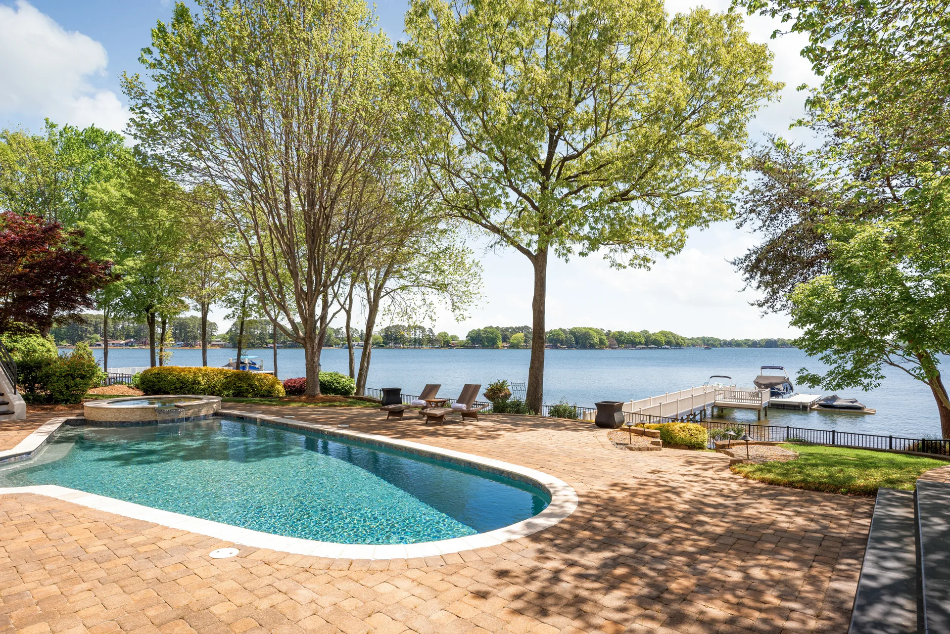 Luxury waterfront home on Lake Norman with private dock and manicured lawn