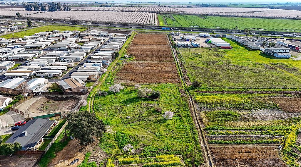 Open field perspective of the 2577 Lobo Ave property with horizon view