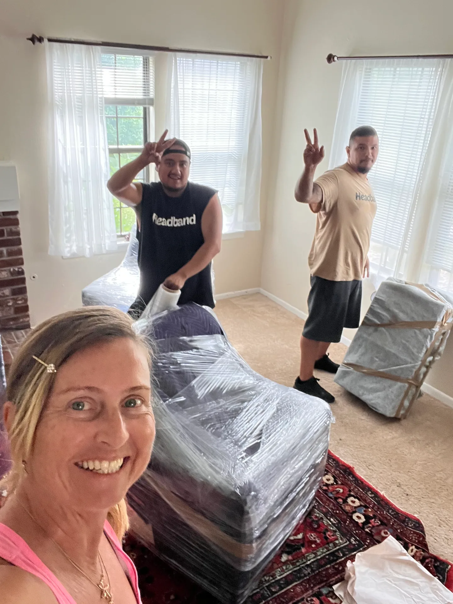 Headband Movers crew working together inside a home, protecting the property during the move