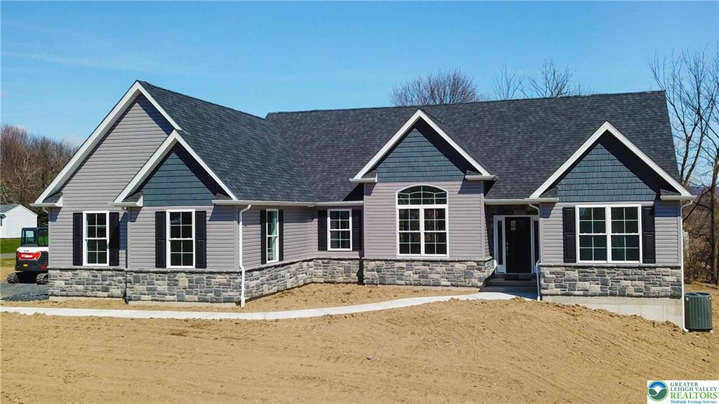 Newly constructed home exterior in the Lehigh Valley with a welcoming front porch and modern finishes