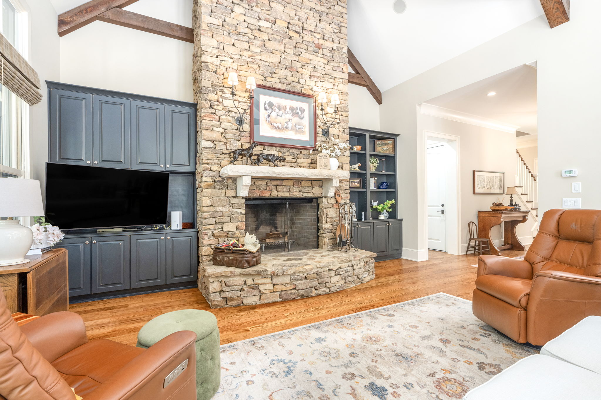 Living room featuring exposed wood beams