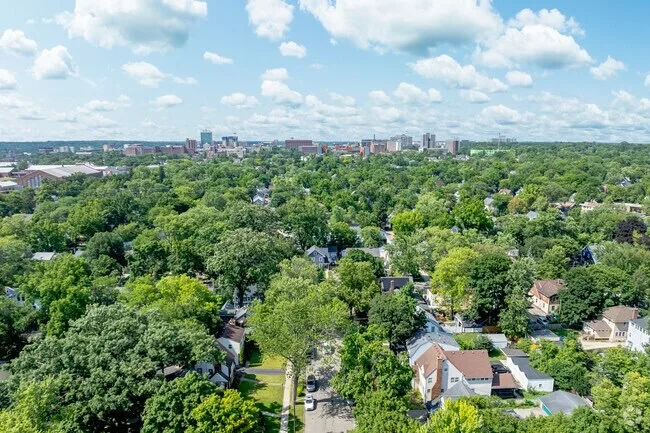 Aerial view of Burns Park with leafy streets and the Ann Arbor skyline in the distance