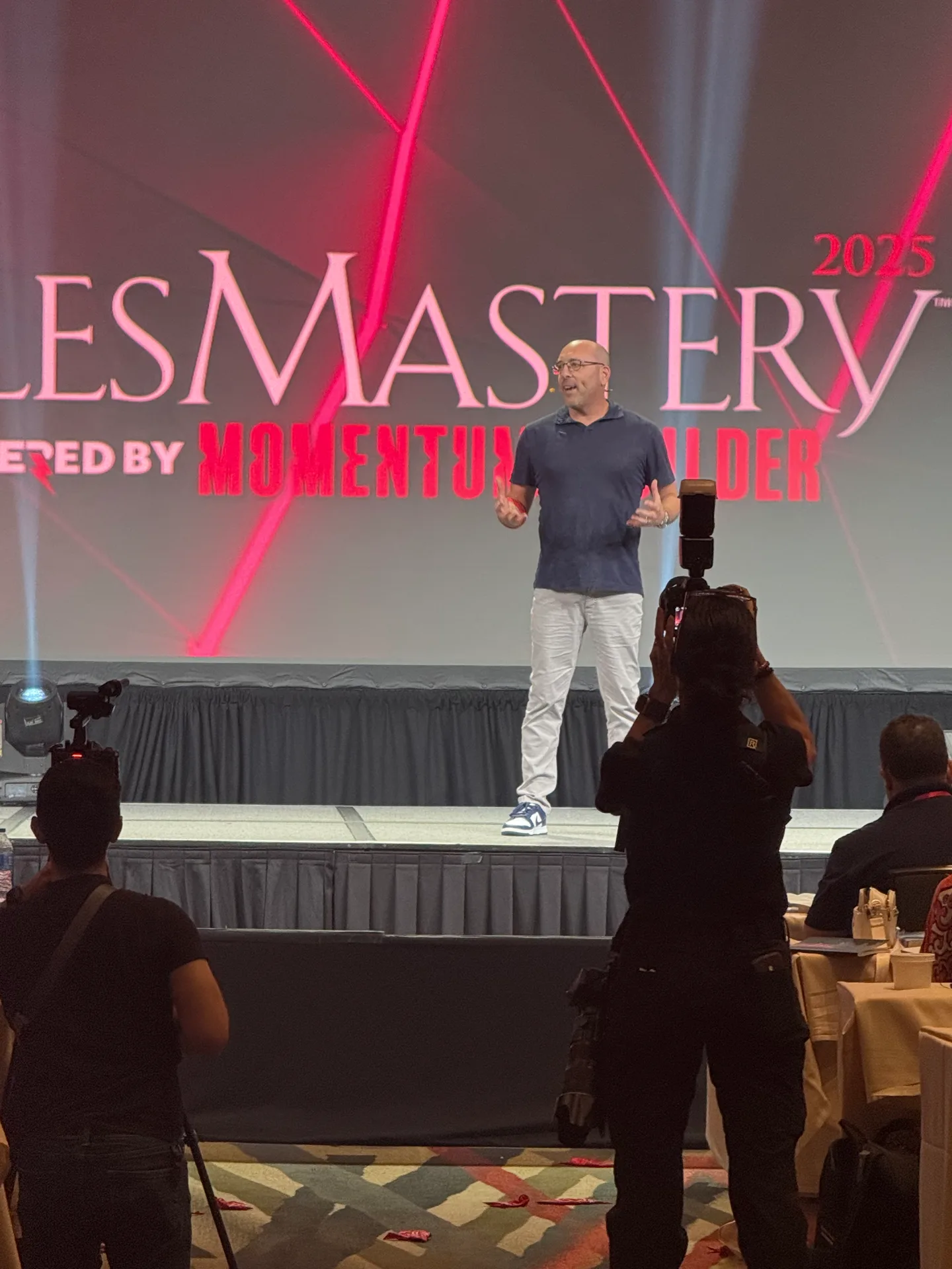 Craig Davis on stage at Sales Mastery 2025, powered by Momentum Builder