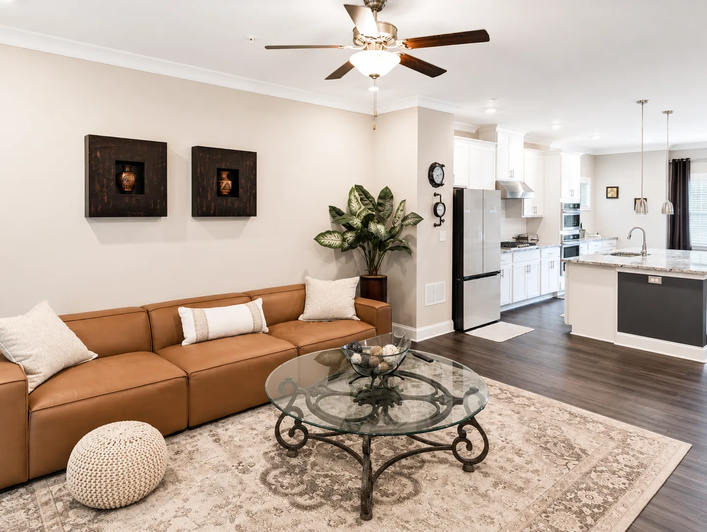 Open-concept living room and kitchen at 144 Boxcar Way with hardwood floors and modern design