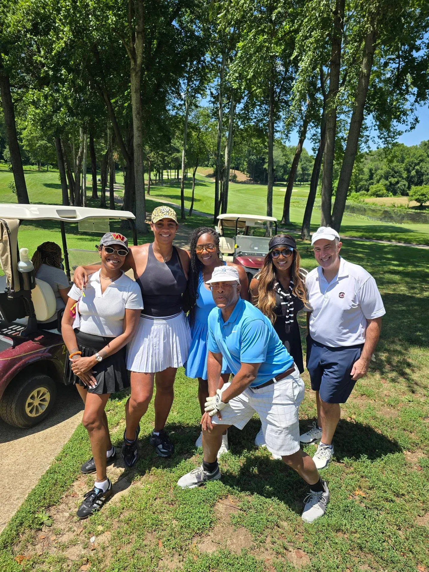 Group posing on the course at the FORE the KIDS Golf Tournament