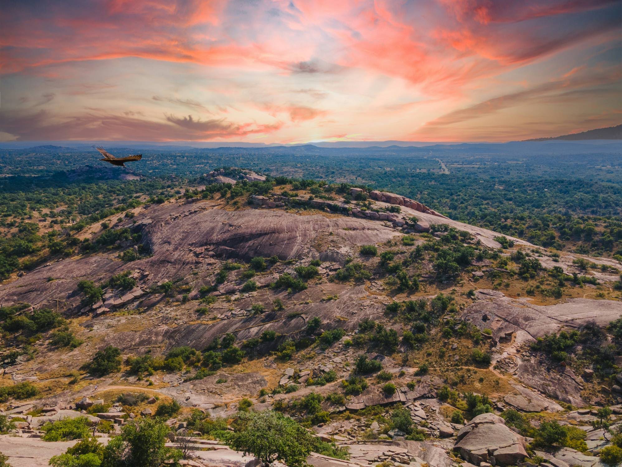 Hikers at Enchanted Rock State Natural Area in the Texas Hill Country