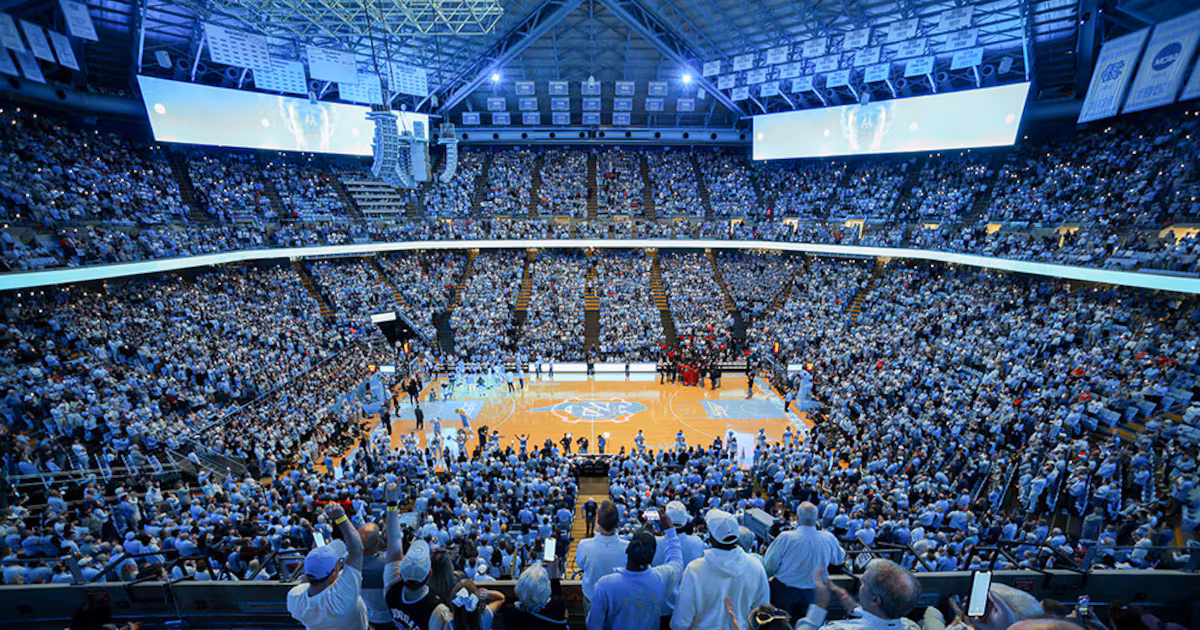 Interior of Dean Smith Center during UNC basketball game with Carolina Blue crowd