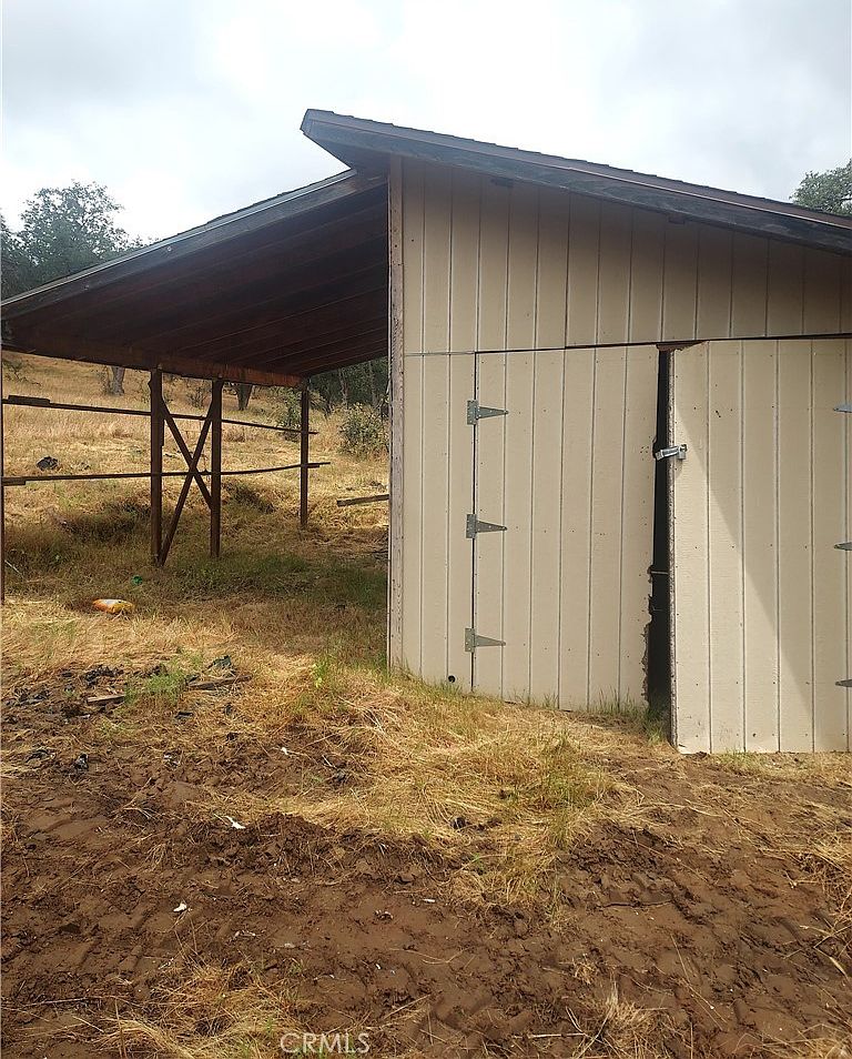 View of the 34.32-acre lot with sloped topography and natural brush