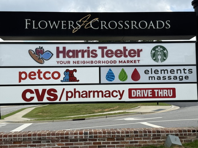 Flowers Crossroads shopping center retailers sign