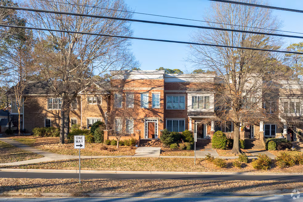 Tree-lined residential street in Briarcliff Heights with mid-century ranch homes and mature shade trees
