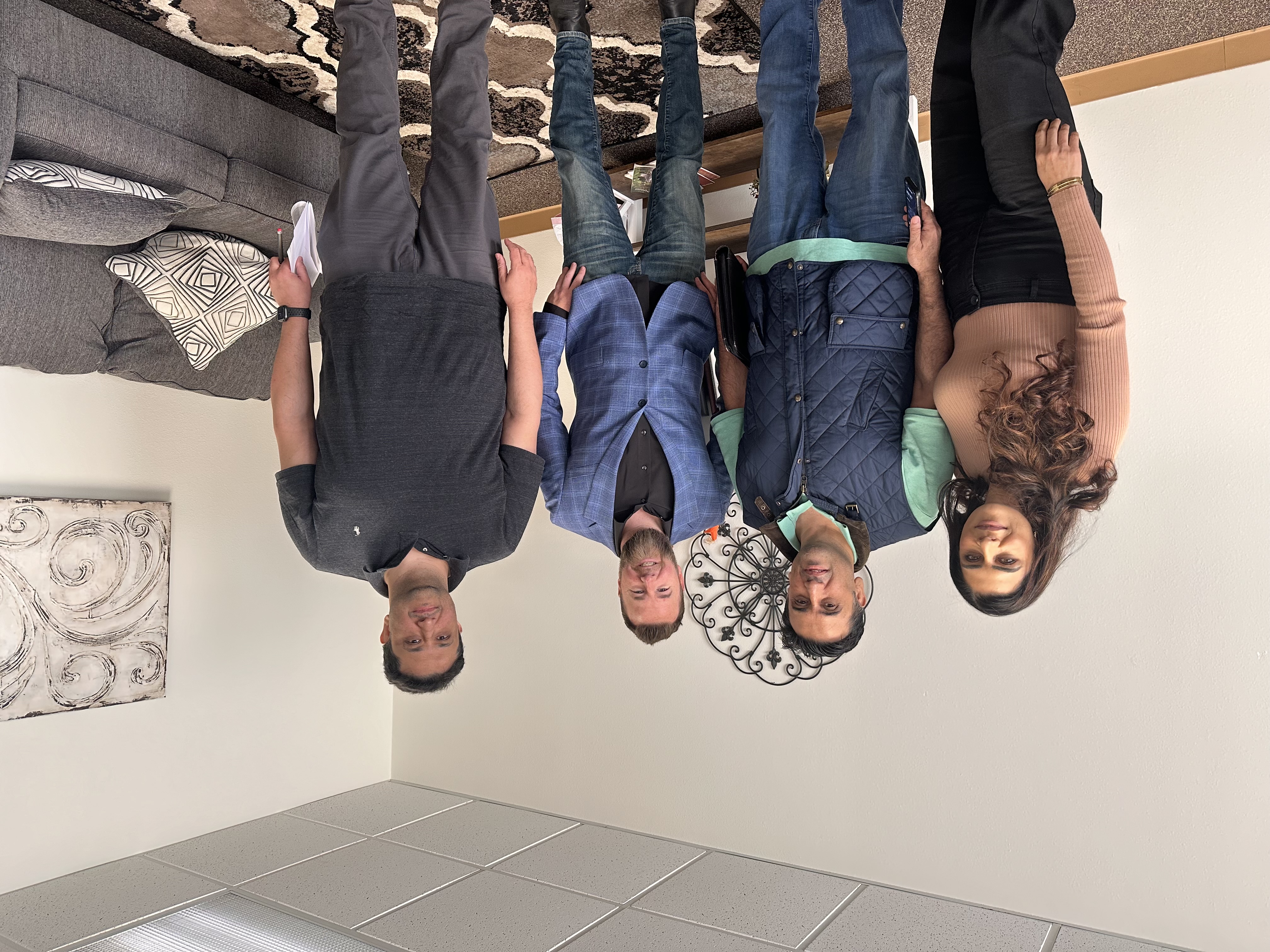 Closing celebration at title company office with happy clients