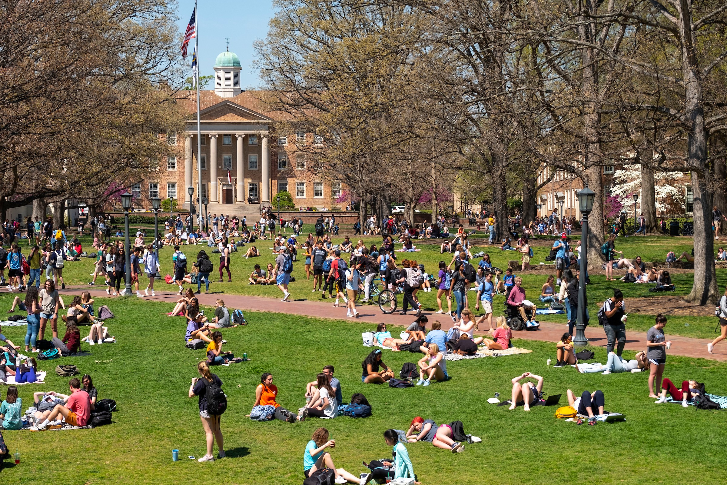 UNC students relaxing on campus quad in Chapel Hill NC