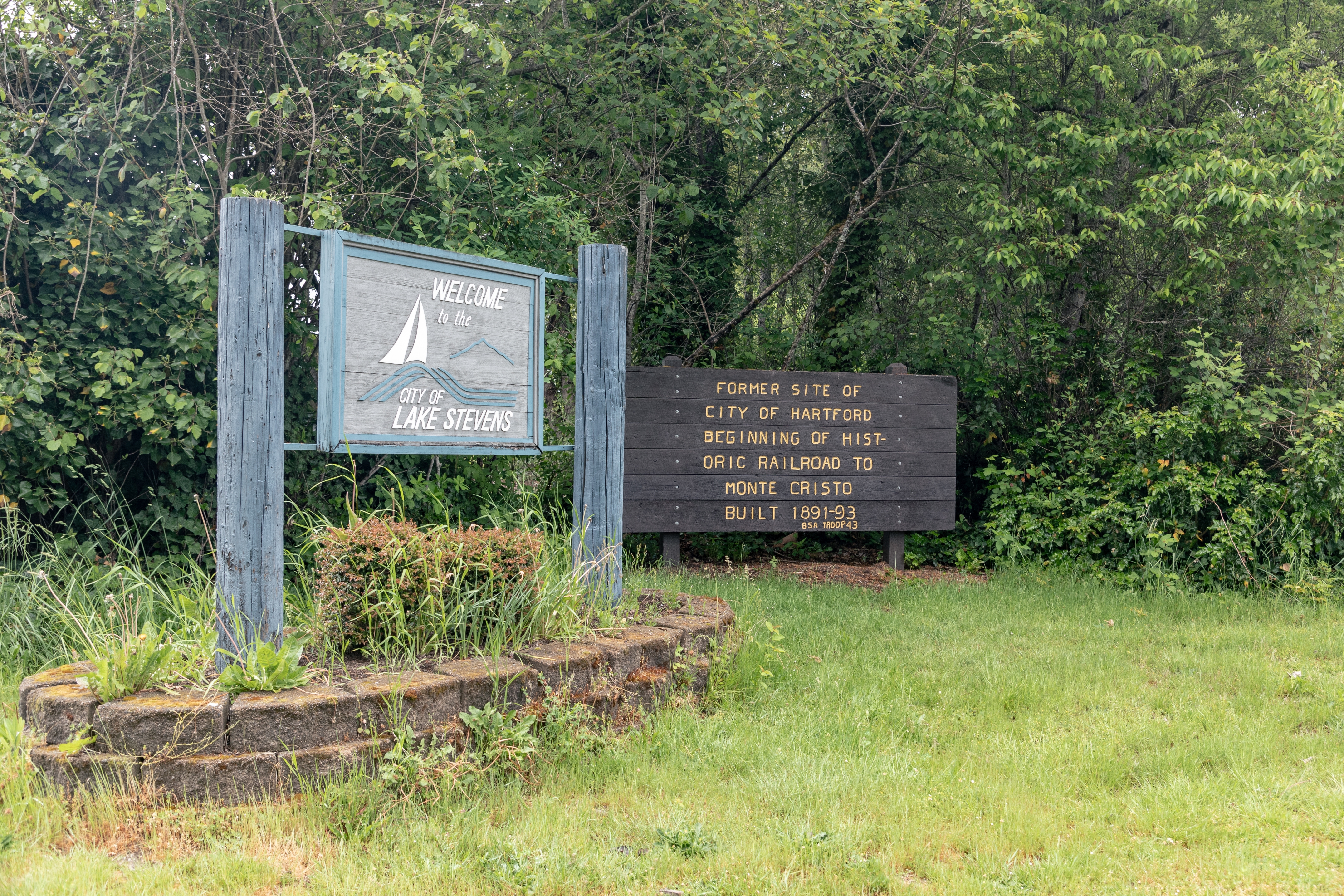 The Welcome to the City of Lake Stevens sign at the historic marker for the former site of the City of Hartford, an early townsite absorbed into Lake Stevens, Washington