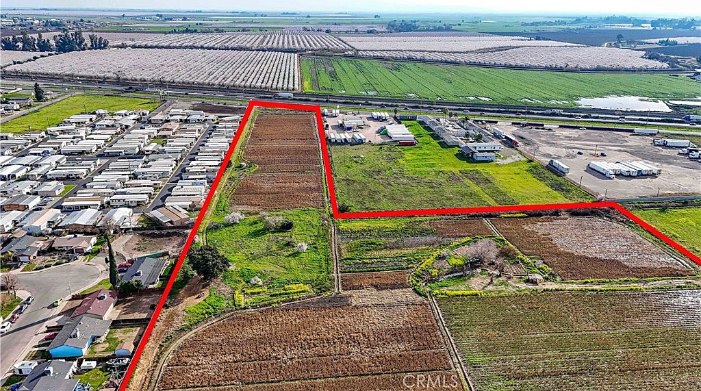 Drone perspective of the full 24.5 acres with Merced backdrop