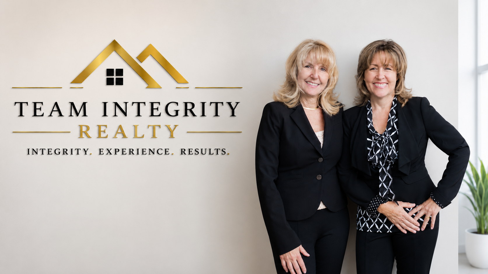 Laura Holbert and Cheryl Shadden of Team Integrity Realty — professional team portrait with branding