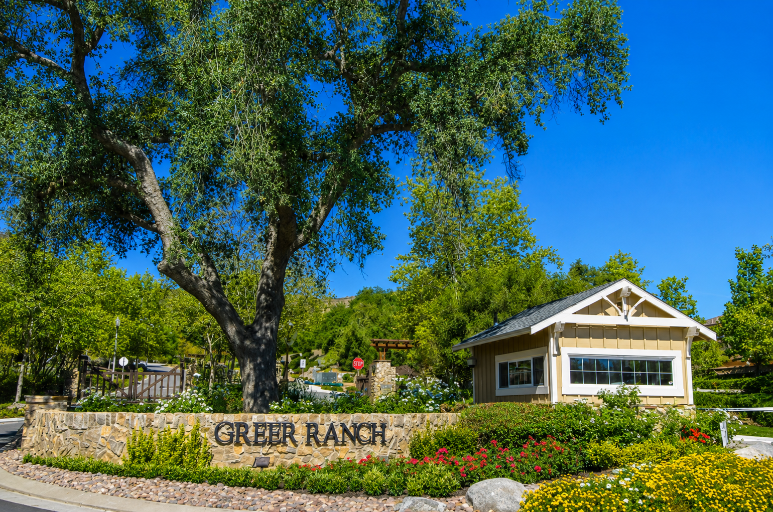 Stone entrance sign for Greer Ranch gated community in Murrieta California