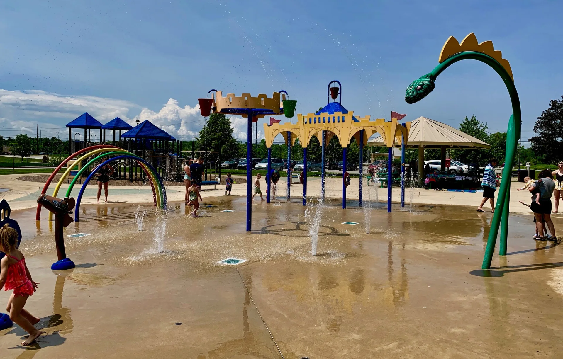 Billericay Park in Fishers with grassy fields, a castle-themed splash pad, and the wooded Billericay Woods nature trail