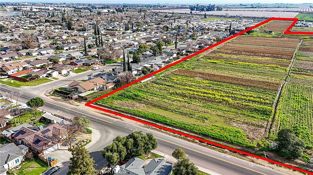 Wide-angle view of the commercial zoned frontage along Highway 99