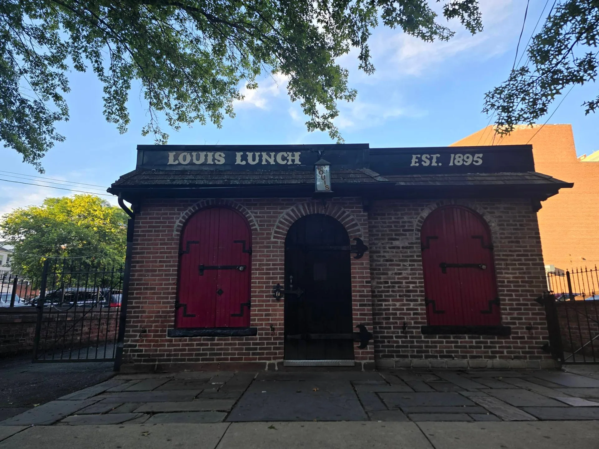 The historic exterior of Louis Lunch on Crown Street, New Haven, established 1895.