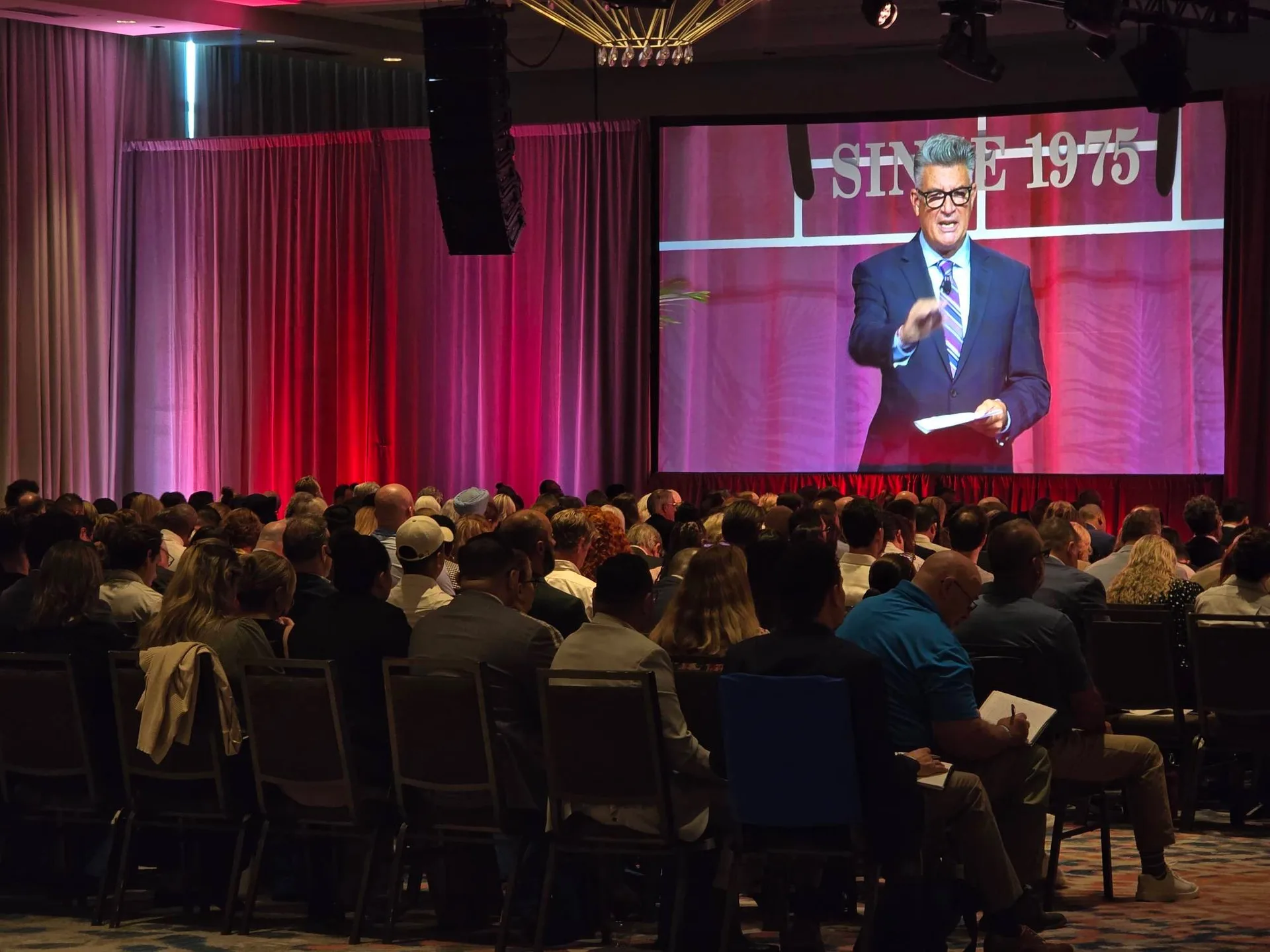 The audience facing the big stage screen during the keynote session at the Mike Ferry 2026 Superstar Retreat at The Diplomat Beach Resort in Hollywood, Florida, with the SINCE 1975 backdrop