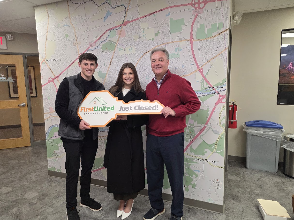 Tim Tepes with clients at a property closing