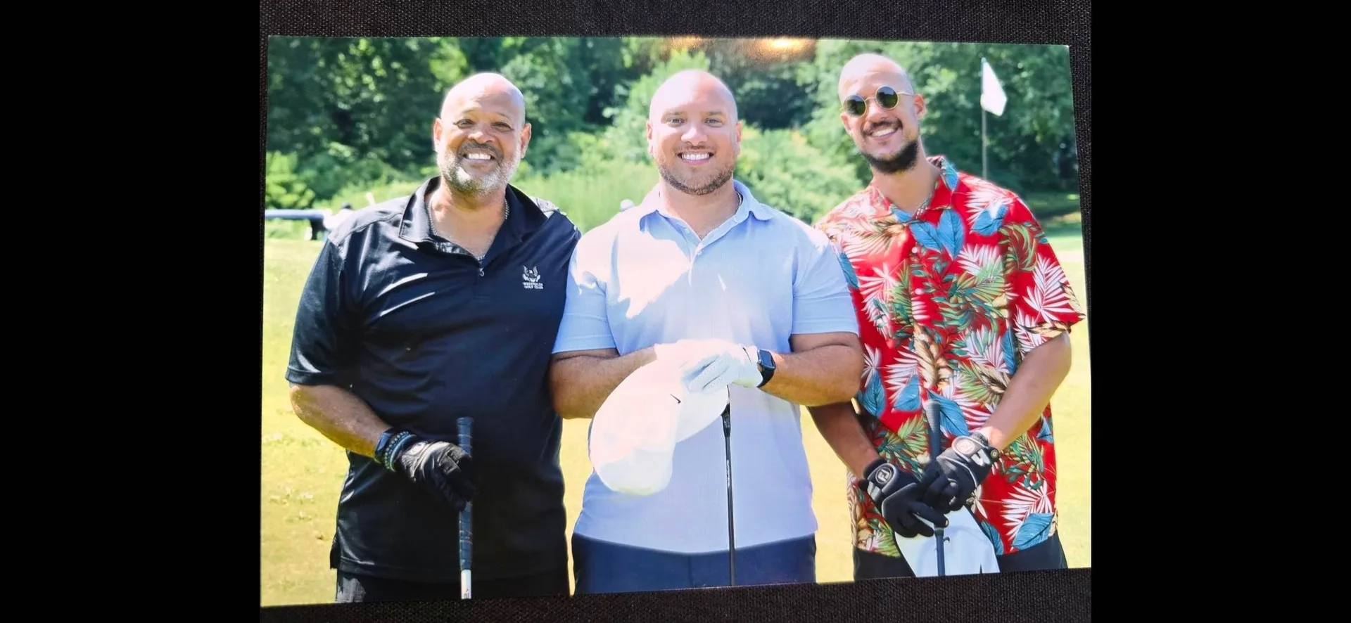 Golfers pose together on the course during the 82nd Annual Knickerbocker Scholarship Tournament at Alling Memorial Golf Club