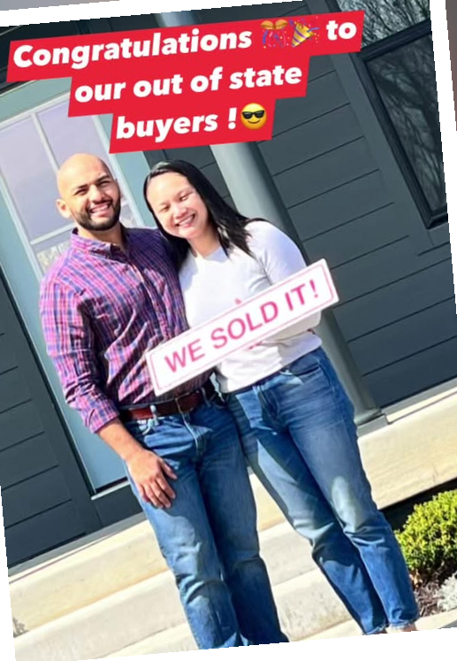 Client celebration photo with WE SOLD IT sign