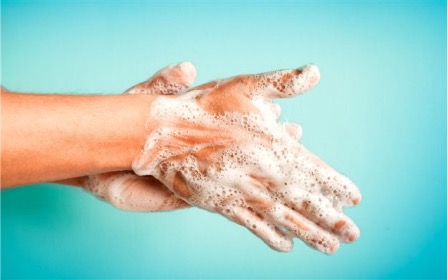 Proper handwashing with soap and lather demonstrating a fundamental infection control protocol for dental practice
