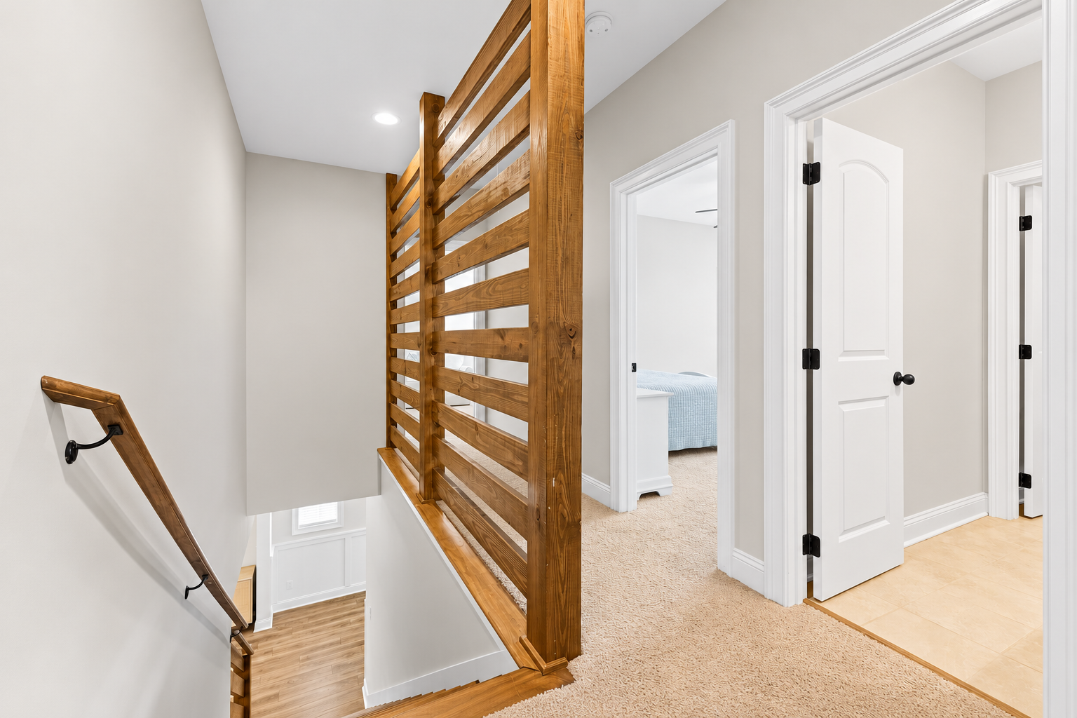 Modern landing with wooden slat details at 1537 Dartmouth Dr, Auburn AL
