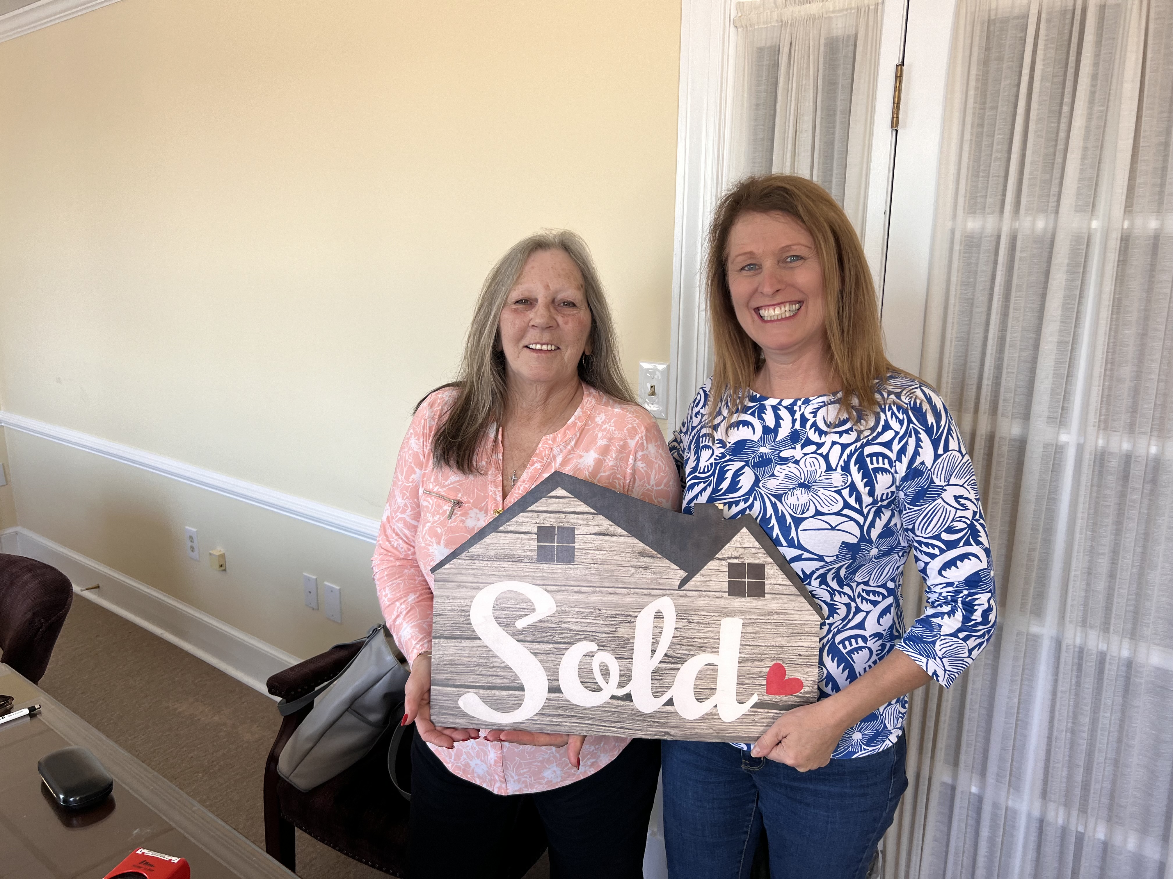 Client photo — happy homeowner after successful closing