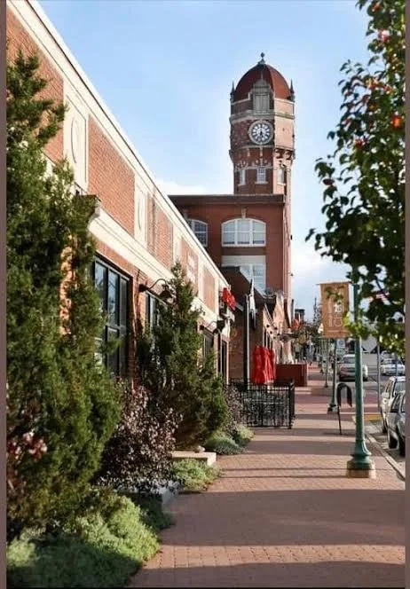 Sunny downtown Chelsea street view with the brick clock tower