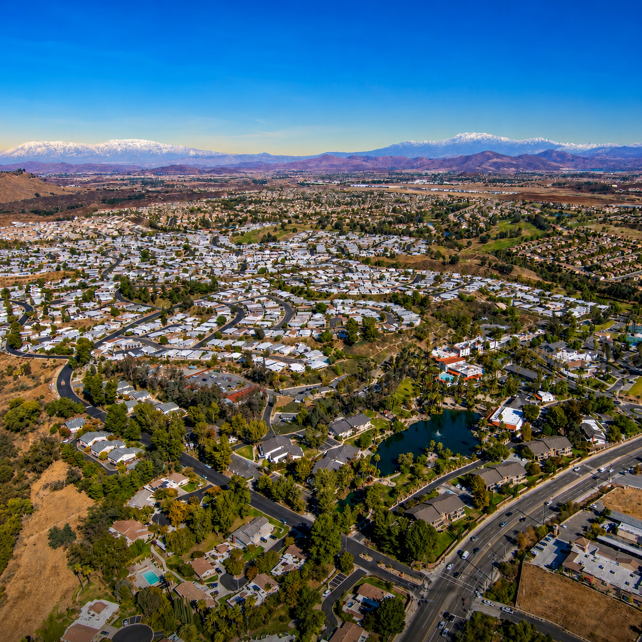 Aerial view of a Southwest Riverside County residential neighborhood with homes and streets