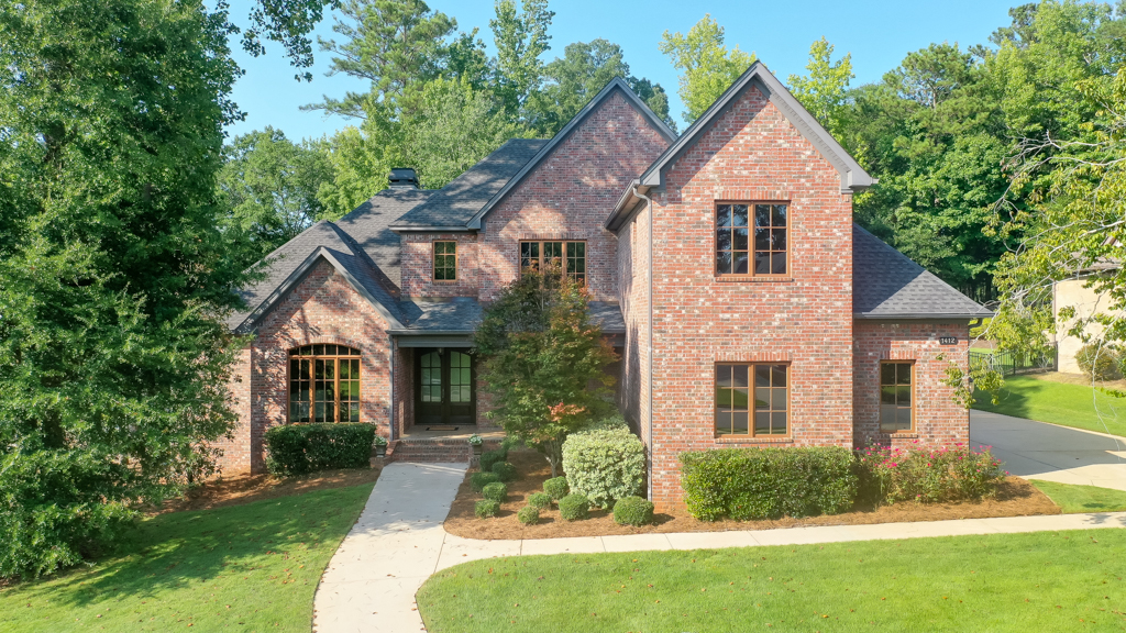 Front exterior of 1412 Falls Crest Dr, custom brick home in Yarbrough Farms, Auburn AL