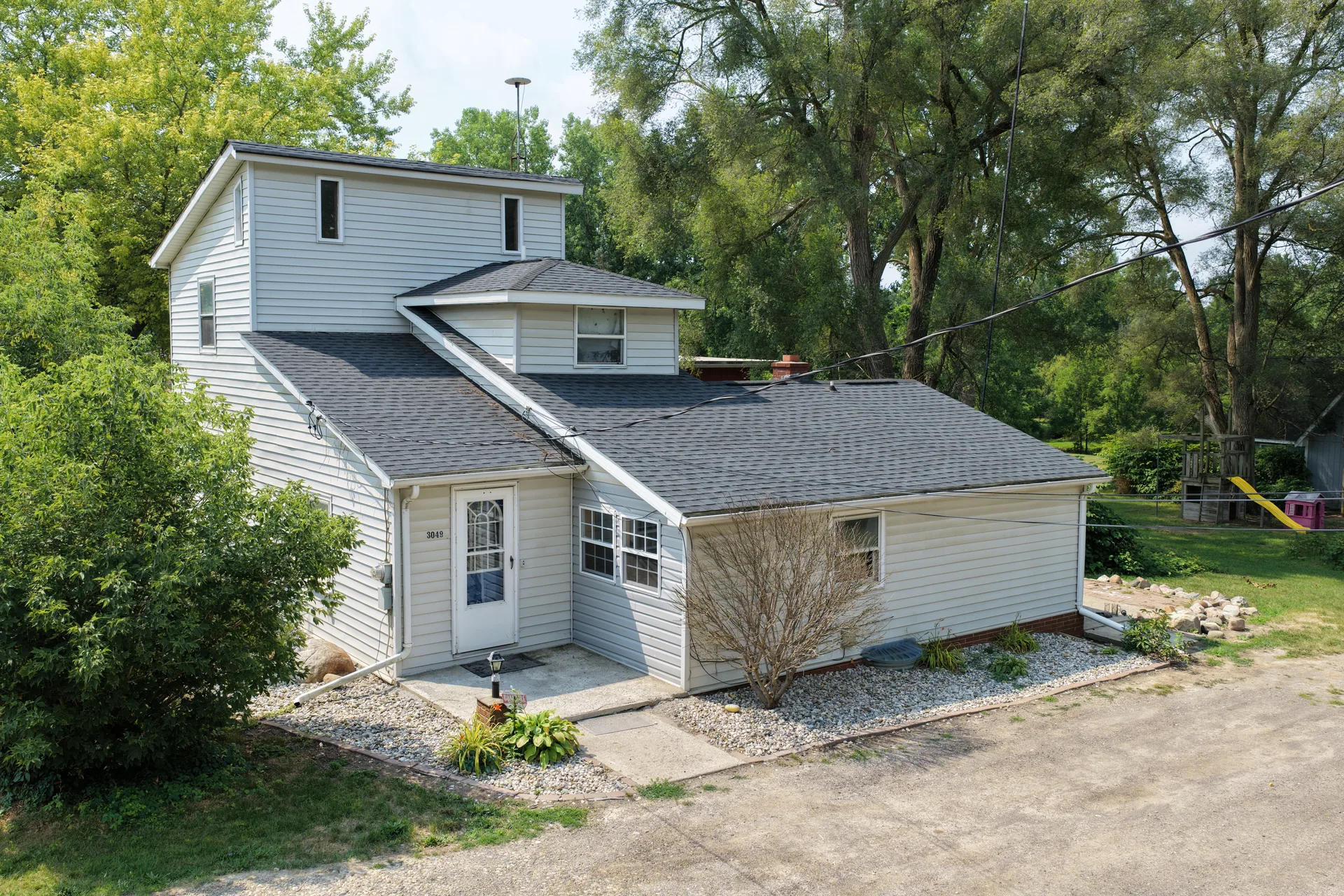Exterior aerial view of a home at 3049 Egleston Avenue in Flint, Michigan — 3 bed, 2 bath, 1,532 sq ft listed by The Moen Group
