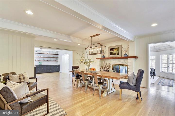 Dining and living space at 7911 Greentree Rd Bethesda Maryland after professional staging