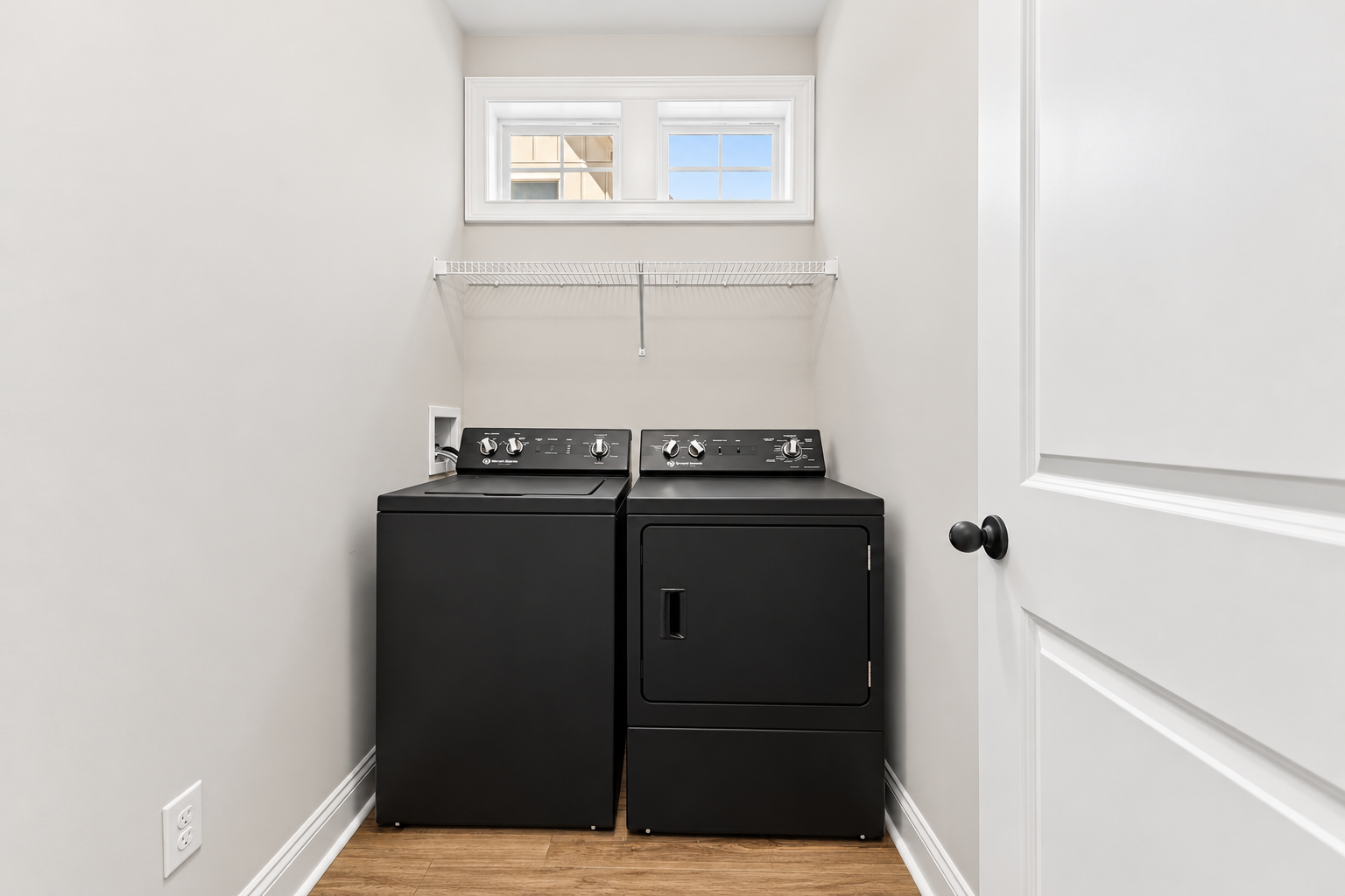 Modern black laundry closet at 1537 Dartmouth Dr, Auburn AL