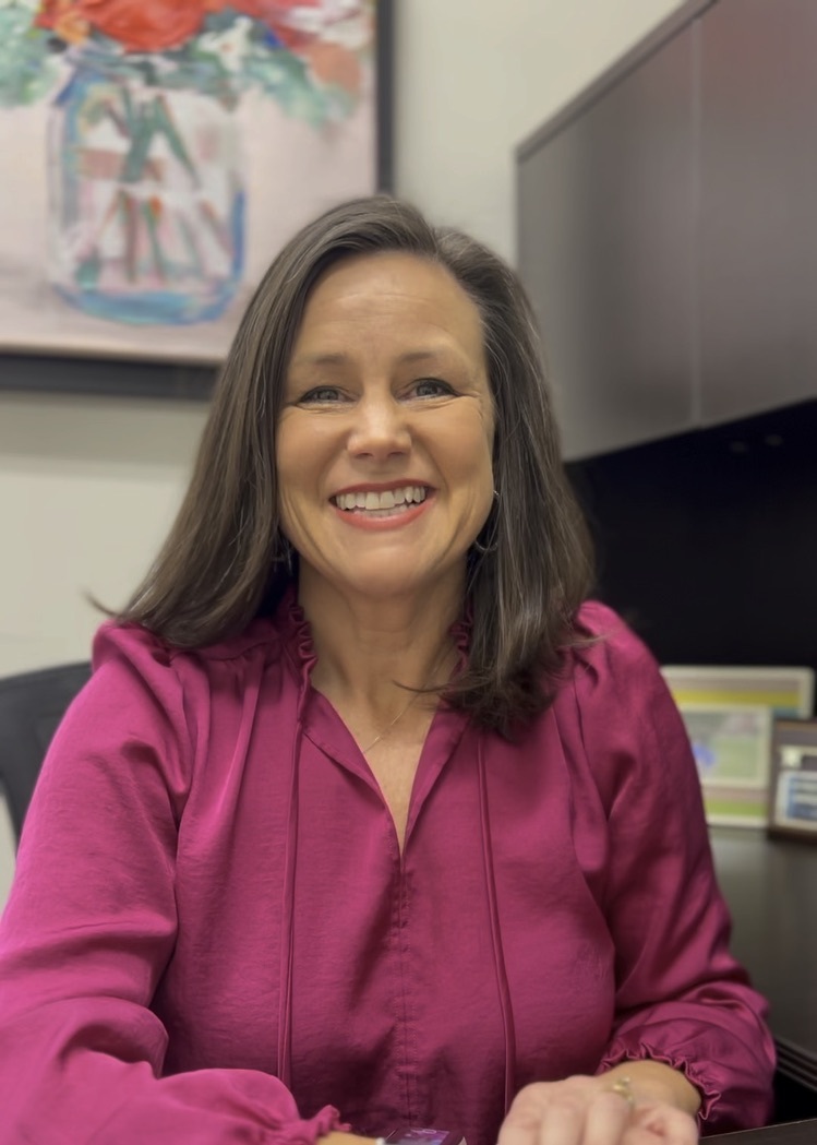 Rozi Dover at her office desk at HomeLink Realty