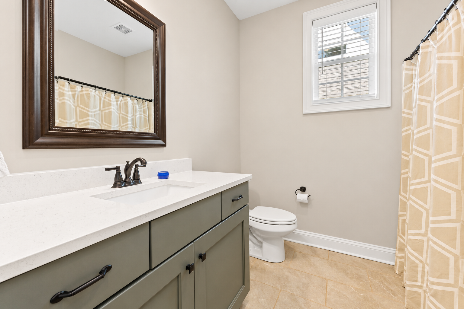 Bright sage-green vanity bathroom at 1537 Dartmouth Dr, Auburn AL