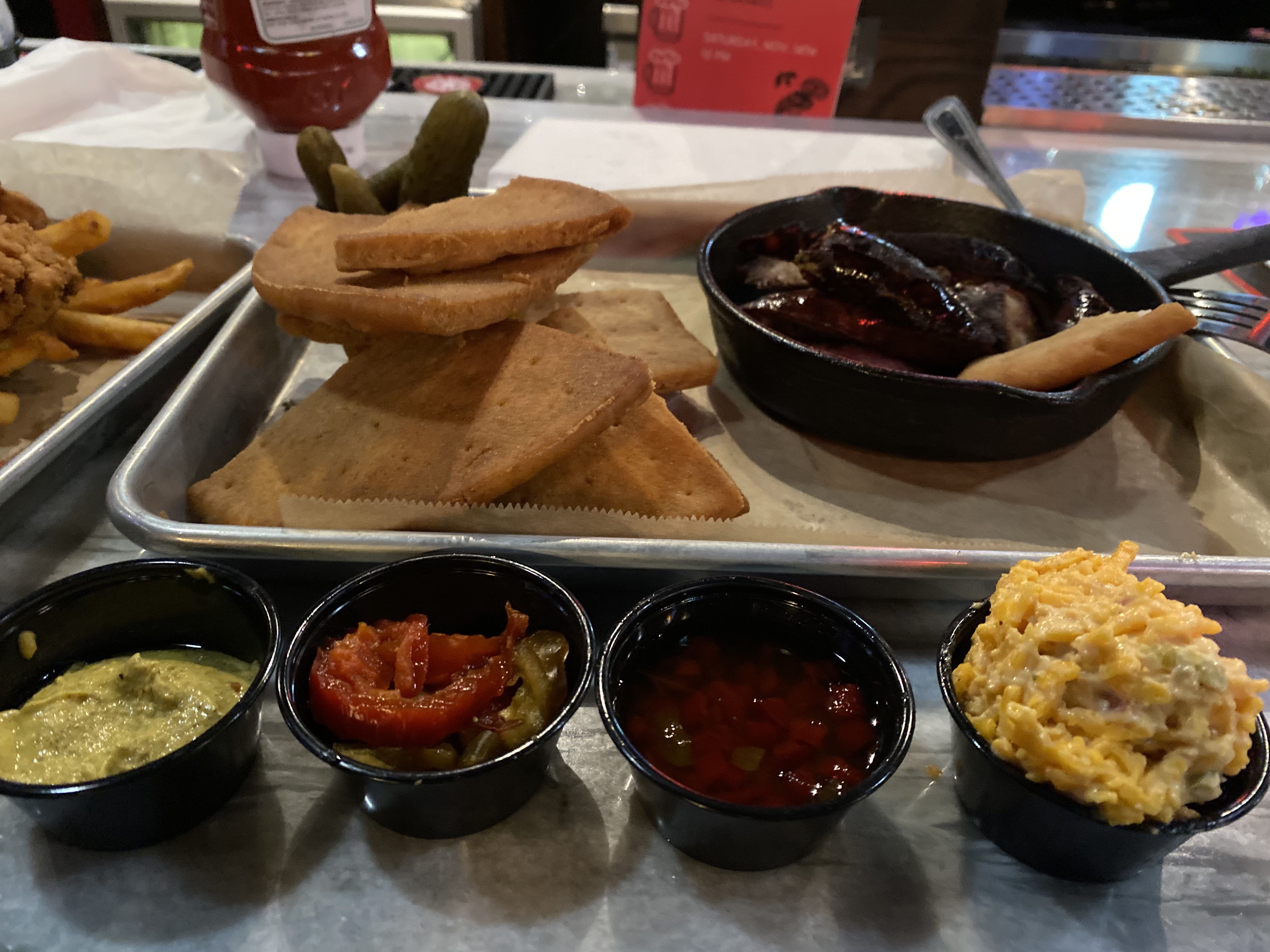 Charcuterie platter with smoked meat pimento cheese and seasonal dips at Jack's Public House in Braselton Georgia